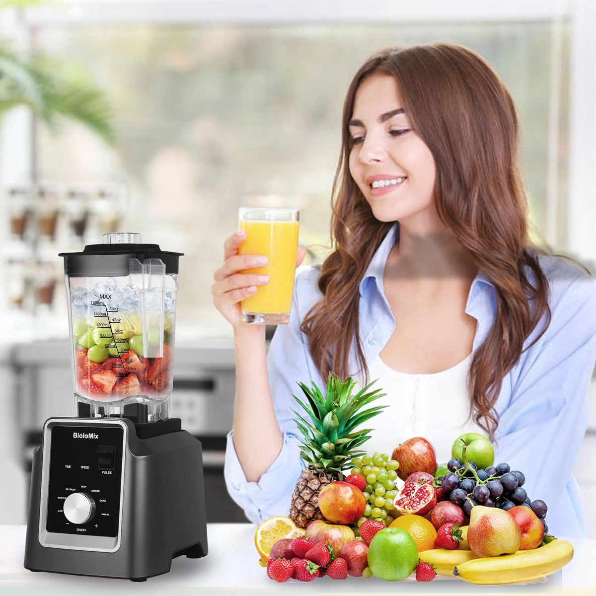 Woman with a glass of orange juice next to a HomesshopUK professional blender and fresh fruit.