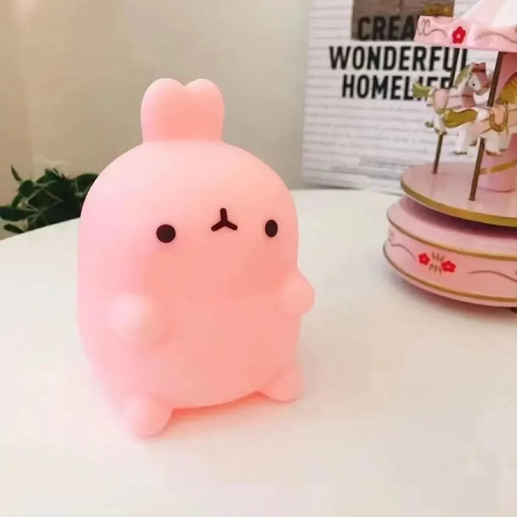 Pink rabbit night light from HomesshopUK on a white surface.