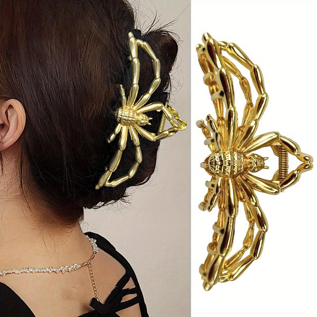 Gold spider hair claw clip for Halloween worn in hair and shown as a standalone product.
