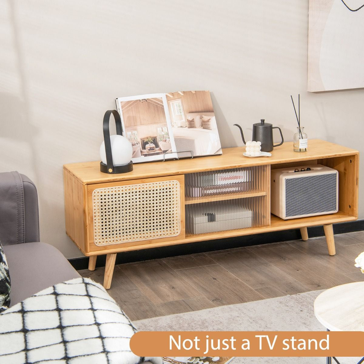 Bamboo Entertainment Center Featuring Rattan Accents and Tempered Glass Sliding Doors